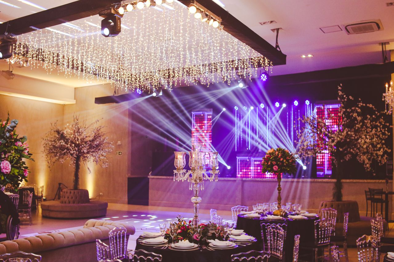 The Art of Drawing Readers In: Your attractive post title goes here Stunning ballroom setup decorated with crystal chandeliers, floral arrangements, and vibrant stage lighting.